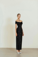 HACCHIC COUTURE Vivian black off-shoulder pencil gown displayed on a model, featuring a fitted silhouette and elegant design.