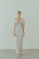Beige off-shoulder pencil gown by HACCHIC COUTURE, featuring a fitted silhouette and elegant design for formal occasions.