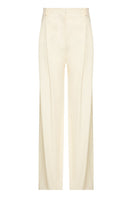 Black wool suit pants by Babukhadia, tailored fit with classic design, shown on a neutral background.