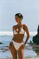 White Stella Ocean bikini bottom by Oceanus, featuring a sleek, seamless design and adjustable side ties for a comfortable fit.