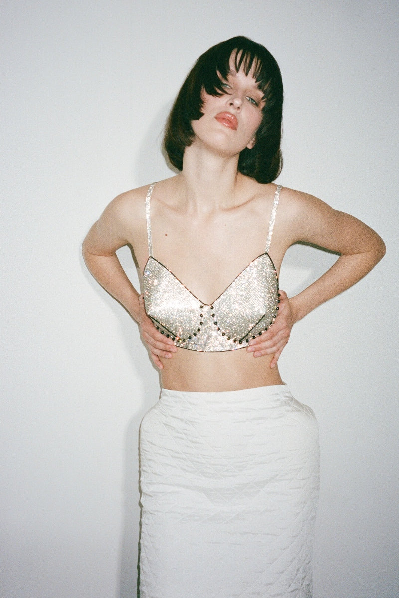 Nué ELLE Bullet Bra in crystal, showcasing the delicate lace and crystal embellishments of the stylish bra on a model.