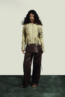 Double A Harlow brown leather pants, stylish women's pants with a sleek fit and detailed stitching, shown on a model.