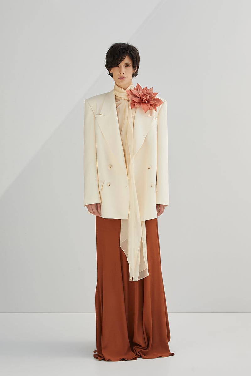 White wide lapel blazer by Babukhadia, tailored fit with structured shoulders and sleek design, perfect for formal or smart casual wear.