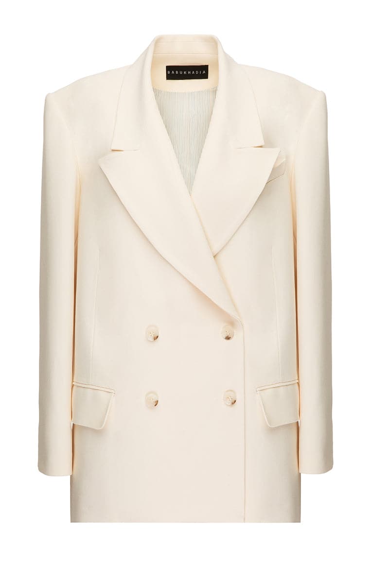 White wide lapel blazer by BABUKHADIA, tailored with a sleek fit, featuring classic lapels and stylish design for a sophisticated look.