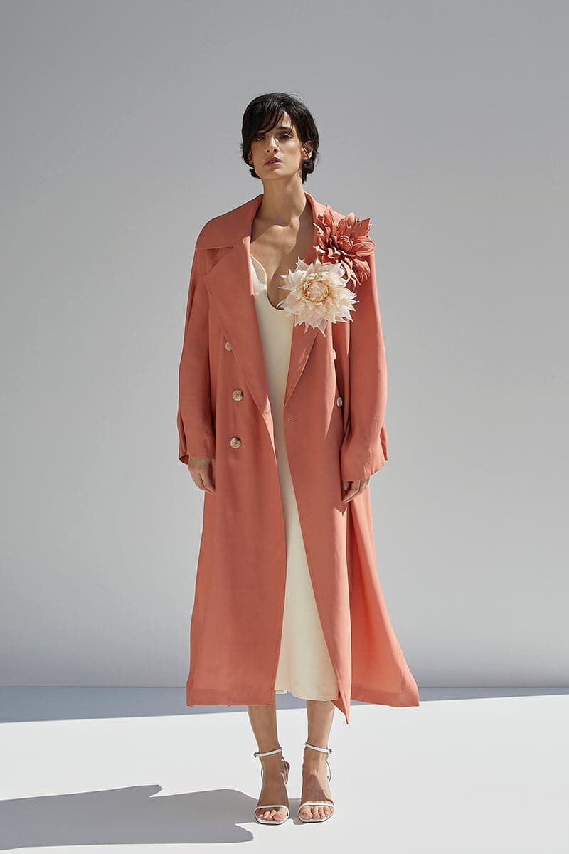Orange wide lapel coat by BABUKHADIA featuring a stylish, tailored design with a prominent collar and clean lines.