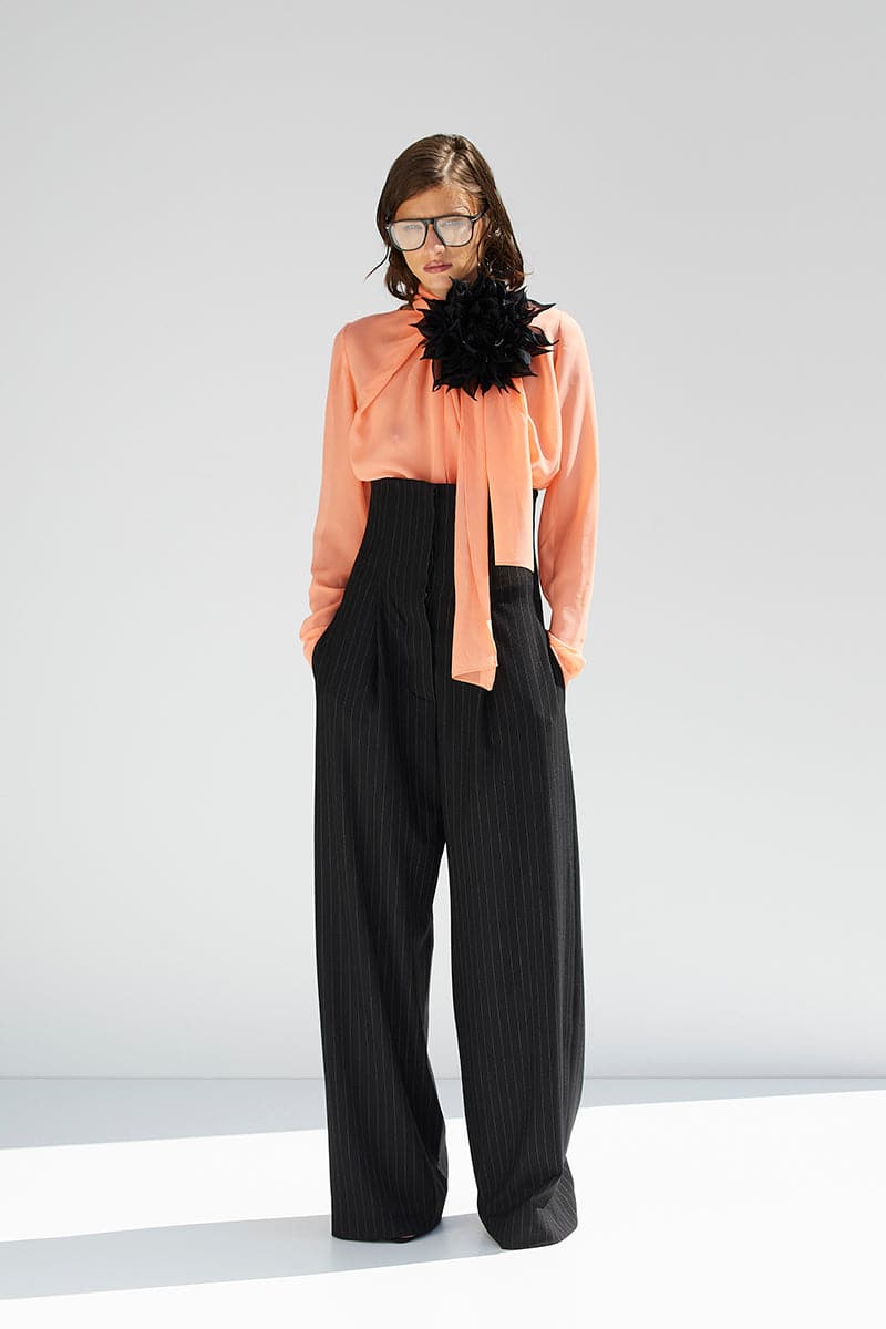 Black loose corset pants by BABUKHADIA, featuring a relaxed fit and stylish design, shown in a full-length image.