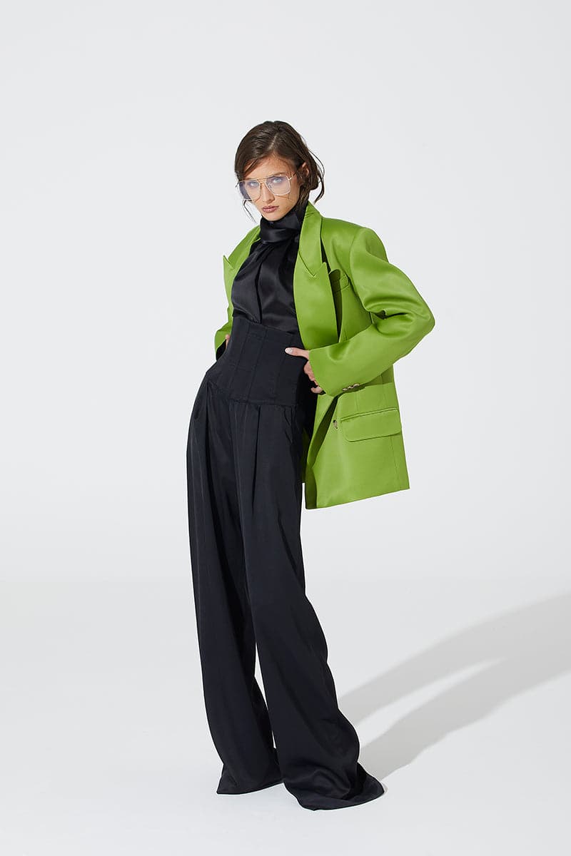 Green wide lapel blazer by Babukhadia, tailored fit with structured shoulders and classic design, shown on a mannequin.