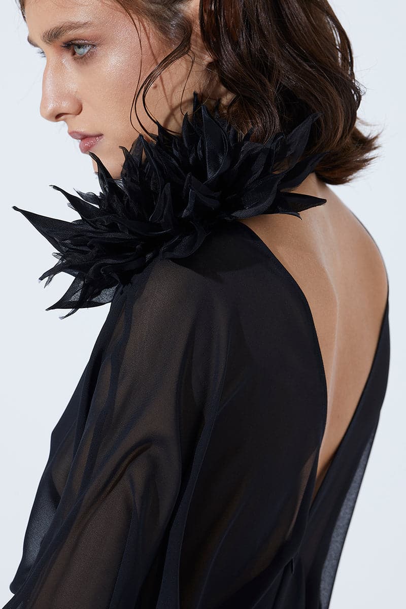 Black flower brooch by Babukhadia featuring detailed floral design, ideal for lapels and accessories