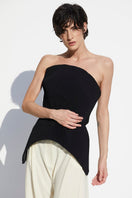 Black strapless peplum top by BABUKHADIA, shown on a hanger with a fitted bodice and flared peplum detail.