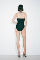 Black Nué Diana bodysuit, a sleek and fitted tops with long sleeves and scoop neckline, displayed on a mannequin.