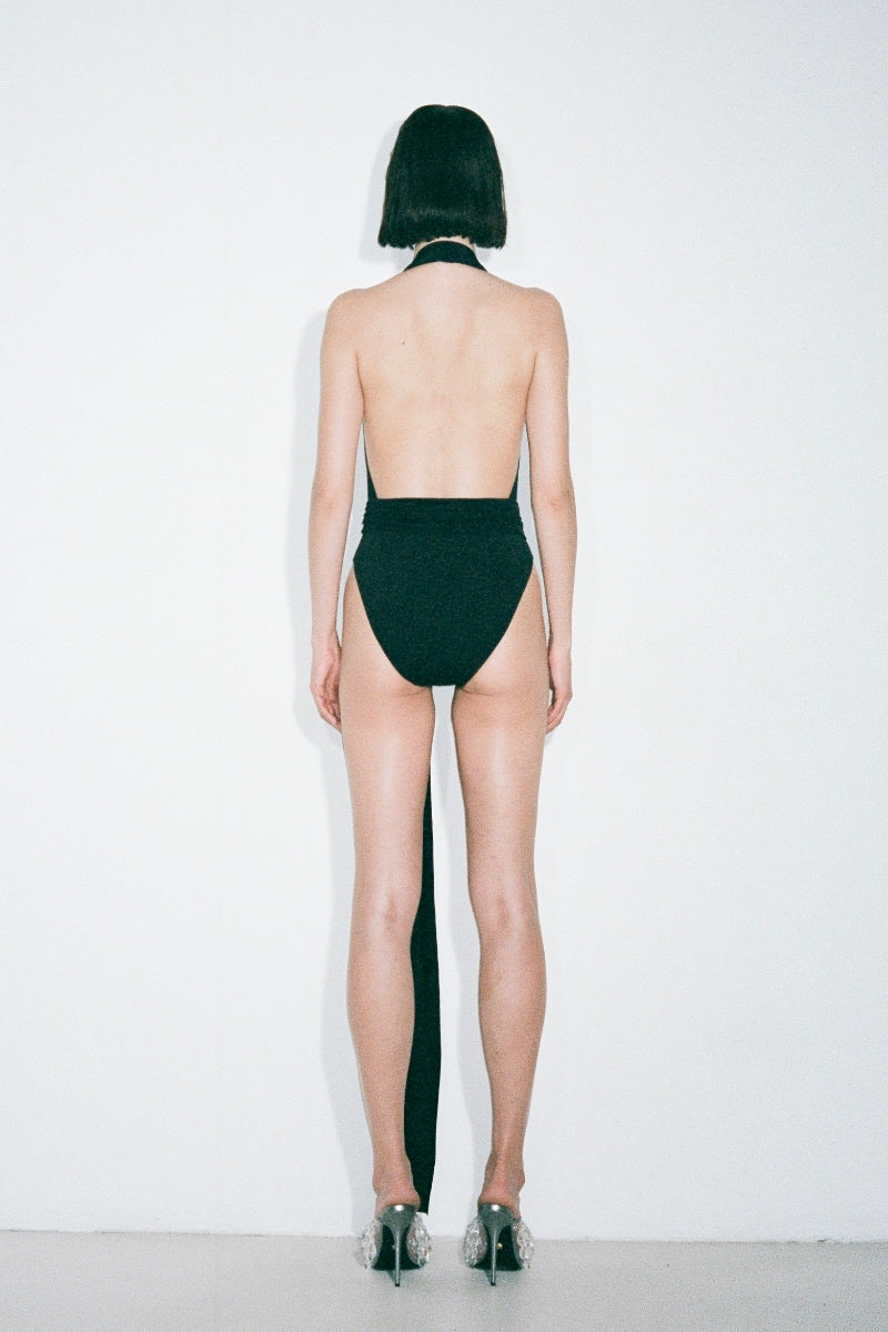 Black Nué Jamie bodysuit, a stylish women's tops featuring a fitted design and sleek fabric, shown on a model.