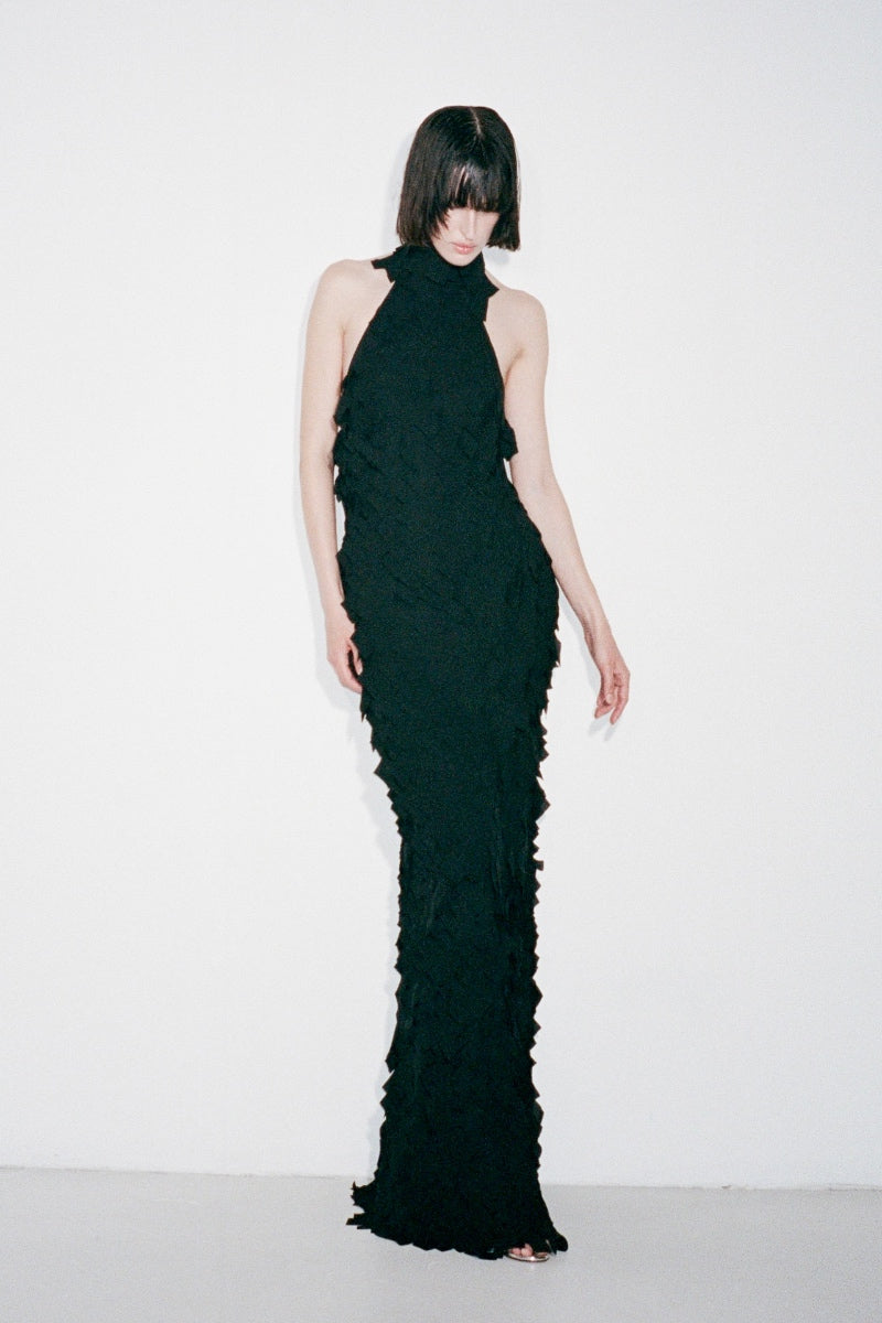 Black Swan gown by Nué, elegant evening dress with flowing fabric and sophisticated design, perfect for formal occasions.