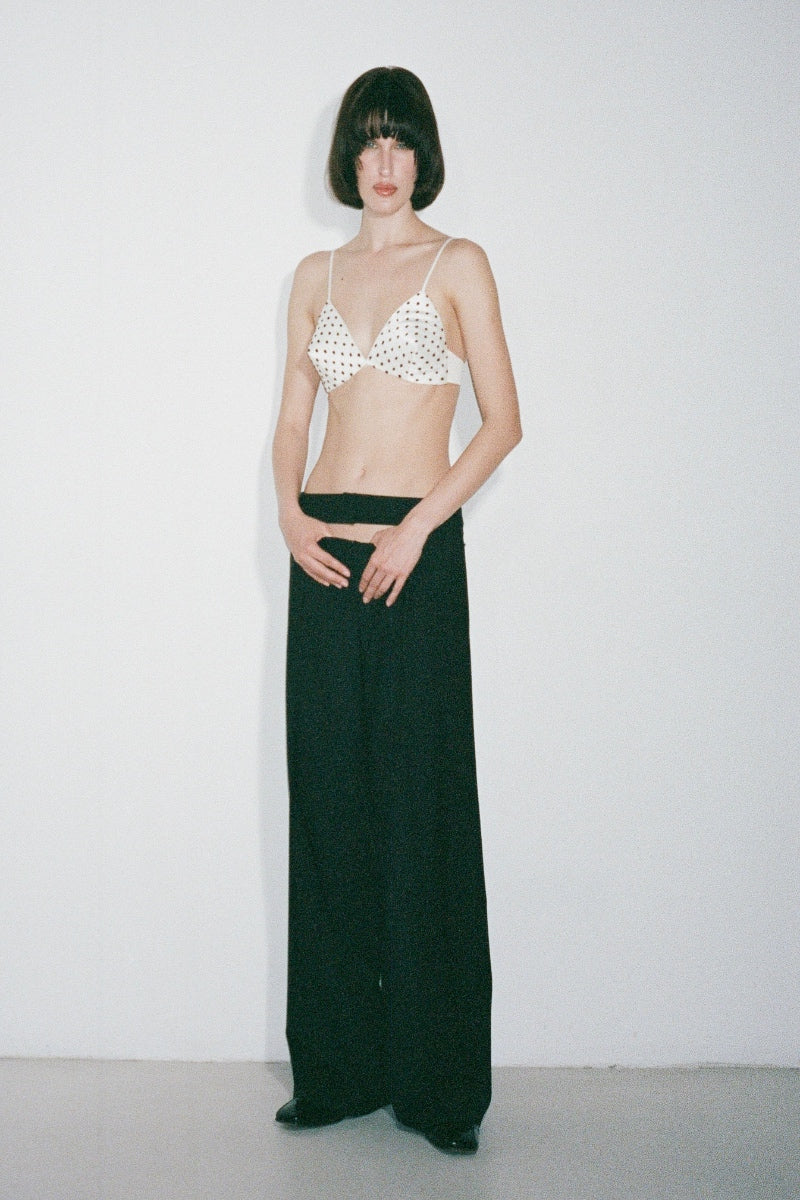 Nué Mimi Bullet Bra in white and black with soft cups and adjustable straps, stylish and comfortable undergarment for everyday wear.