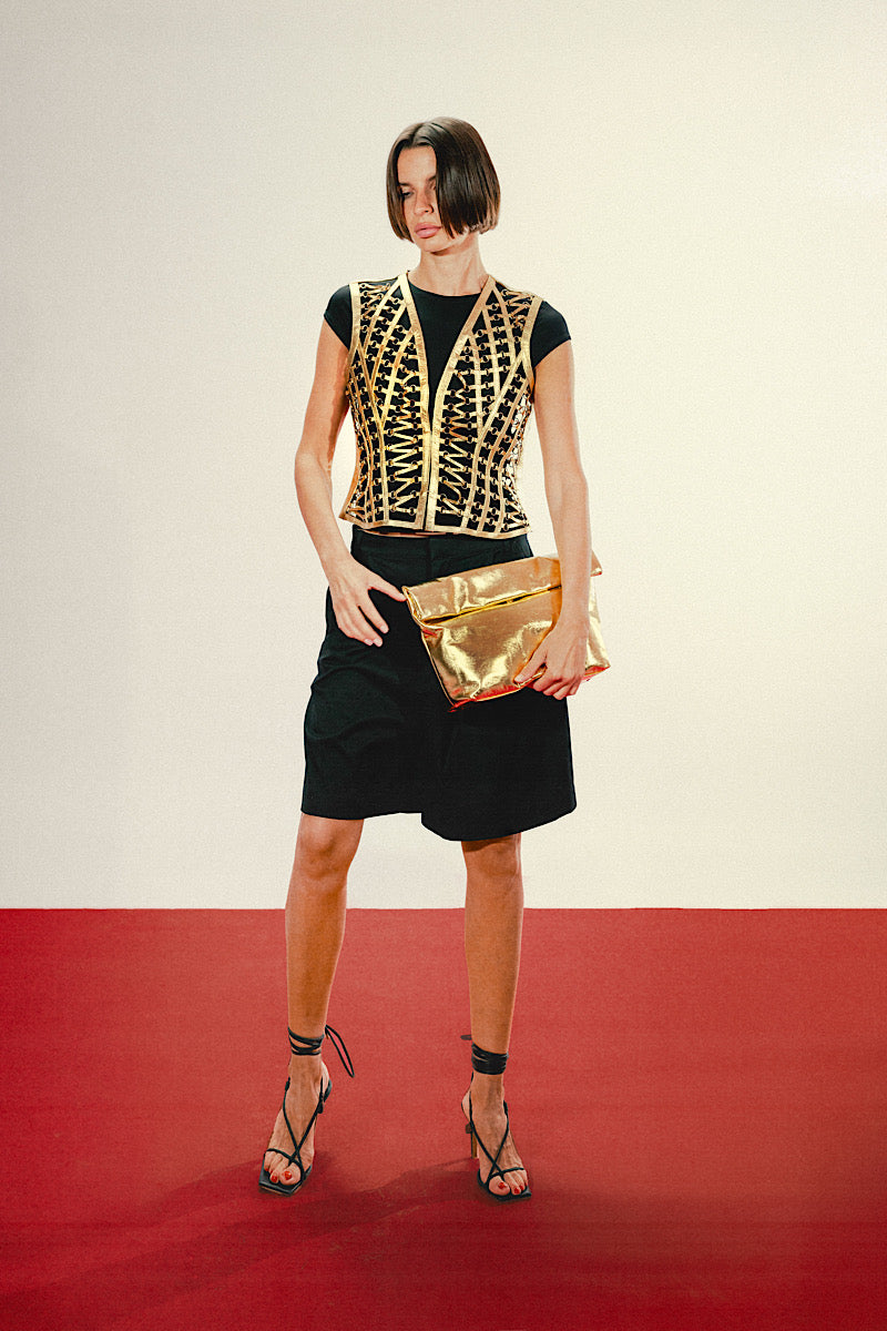 Double A Ariana leather clutch bag in gold with sleek design and textured finish, perfect for elegant evening accessories.