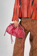 Double A Charlie leather clutch bag in washed red, featuring a sleek design and sturdy zipper closure.