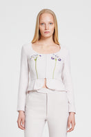 Nara Niro IRIS jacket, a stylish tops piece with a modern design, shown in a close-up view highlighting fabric and details.