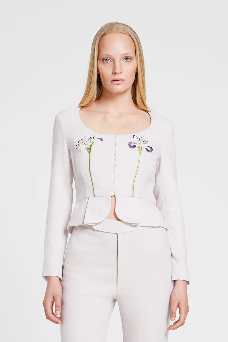 Nara Niro IRIS jacket, a stylish tops piece with a modern design, shown in a close-up view highlighting fabric and details.