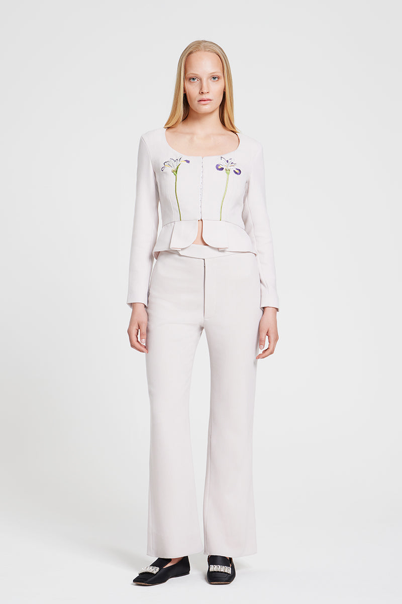 Nara Niro IRIS jacket, stylish long-sleeve top with a modern design, shown in a close-up image highlighting fabric texture and fit.