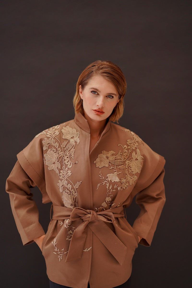 Ecru belted jacket from Nadya Shah's Jules collection, featuring a relaxed fit and stylish design.
