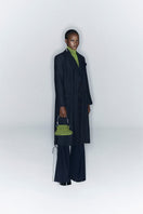 Tailored black coat with side slits from JC Pajares, featuring a sleek fit and stylish design for women.