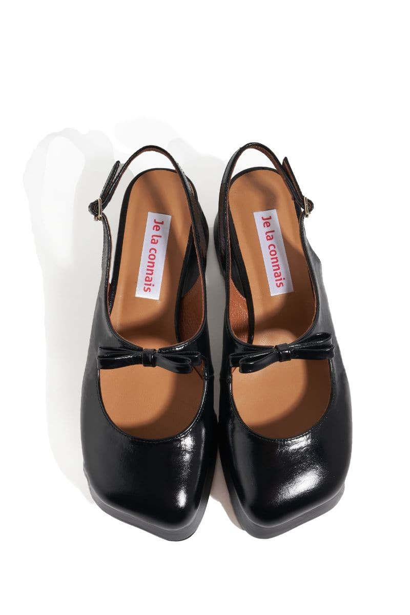 Black Je La Connais Avignon chunky platform heels with thick soles and ankle straps, stylish and bold footwear for women.