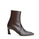 Je La Connais Calais Chocolate ankle boots in brown leather, showing side view with low heel and sleek design.