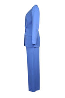 Baby blue hourglass co-ords suit by Joanna Andraos, featuring a fitted top and matching trousers in soft blue fabric.
