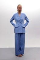 Baby blue hourglass suit co-ords by Joanna Andraos, featuring a fitted top and matching pants in a stylish baby blue hue.