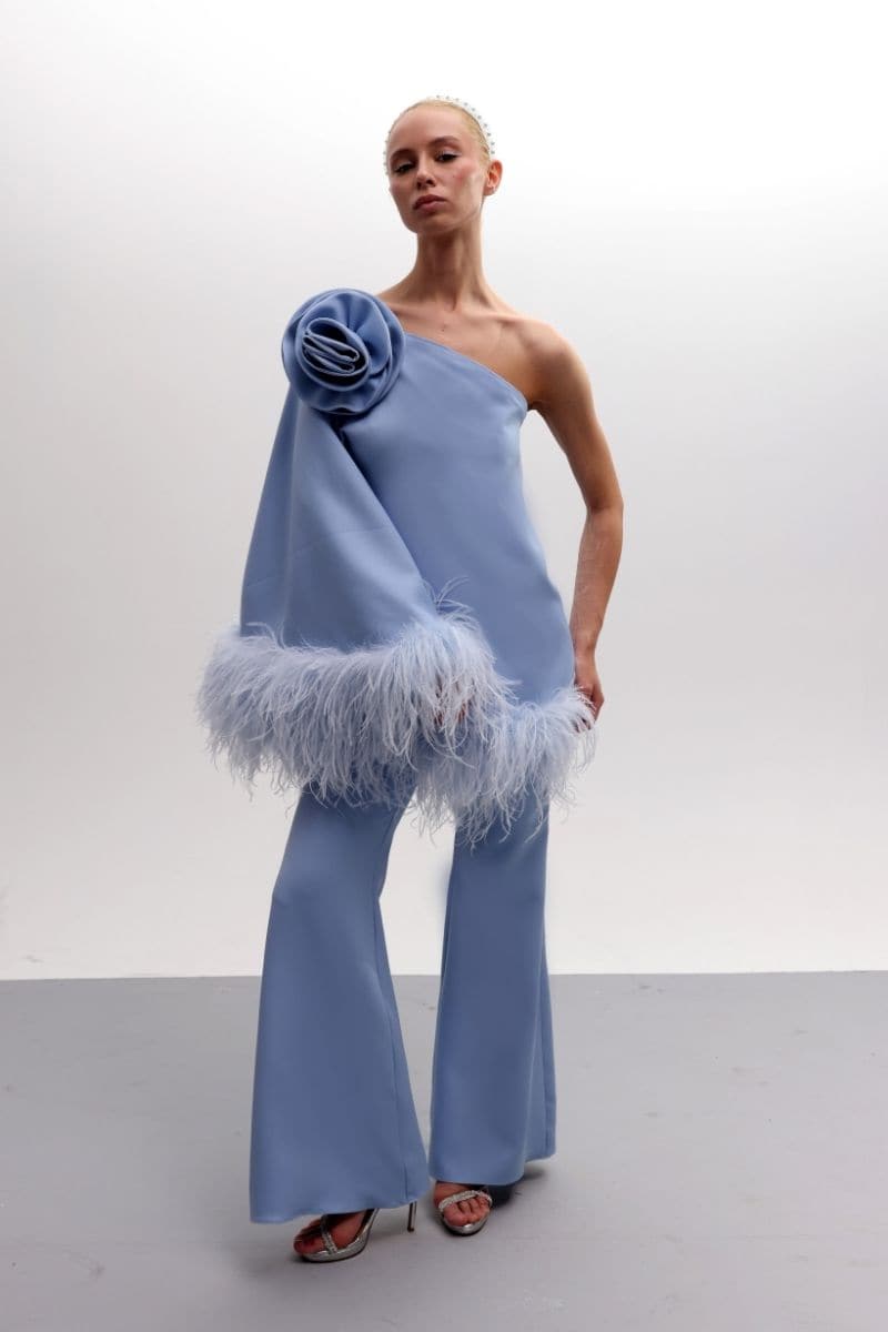 Joanna Andraos feathered floral one-shoulder top and pants co-ords set in baby blue, featuring a stylish, coordinated design.