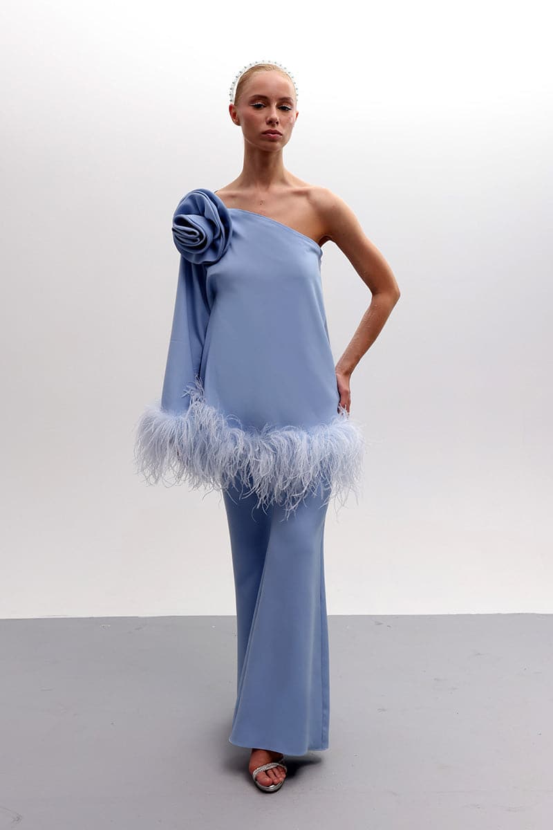 Joanna Andraos feathered floral one-shoulder top and pants co-ords set in baby blue, with a stylish, elegant design.