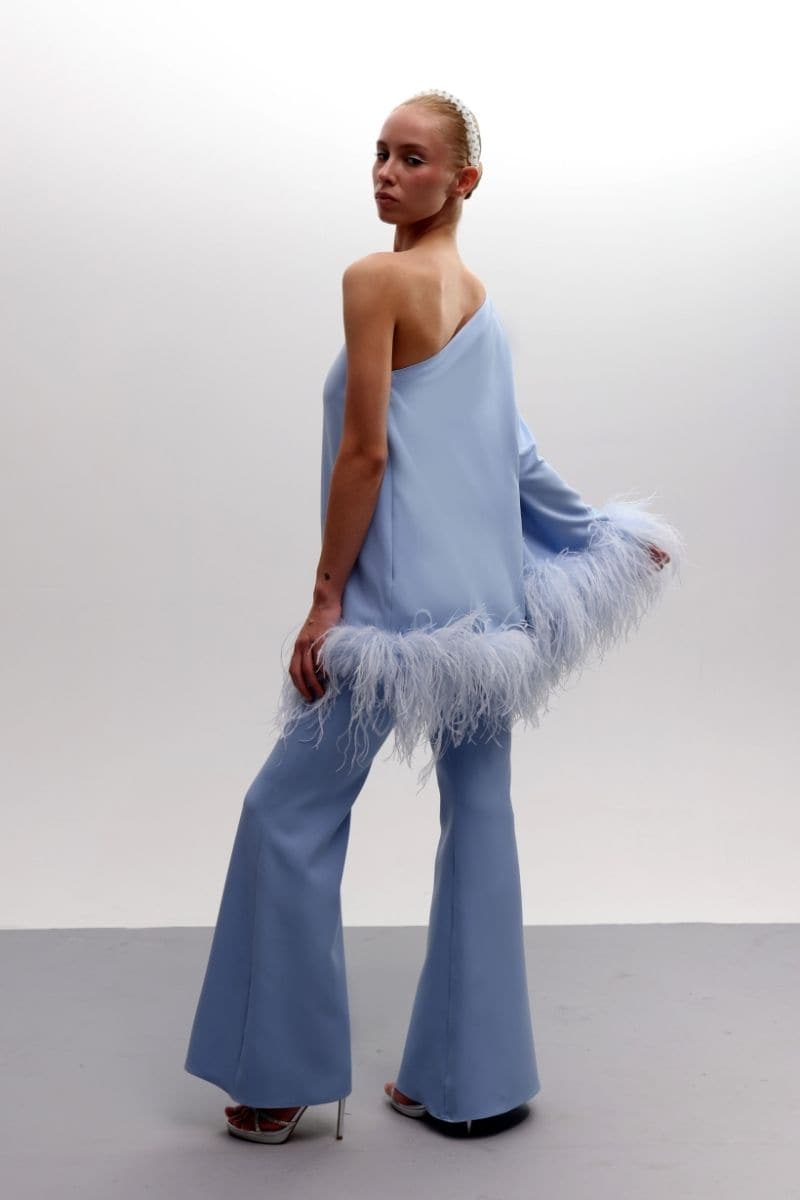 Joanna Andraos feathered floral one-shoulder top and pants co-ords set in baby blue, featuring a stylish, coordinated outfit.