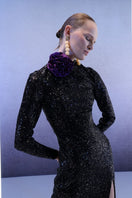 Full-length black sequin gown by Joanna Andraos, featuring a midnight-black design and elegant fit for formal occasions.