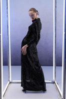 Full-length black sequins gown by Joanna Andraos, showing the elegant midnight black maxi dress with shimmering sequins.