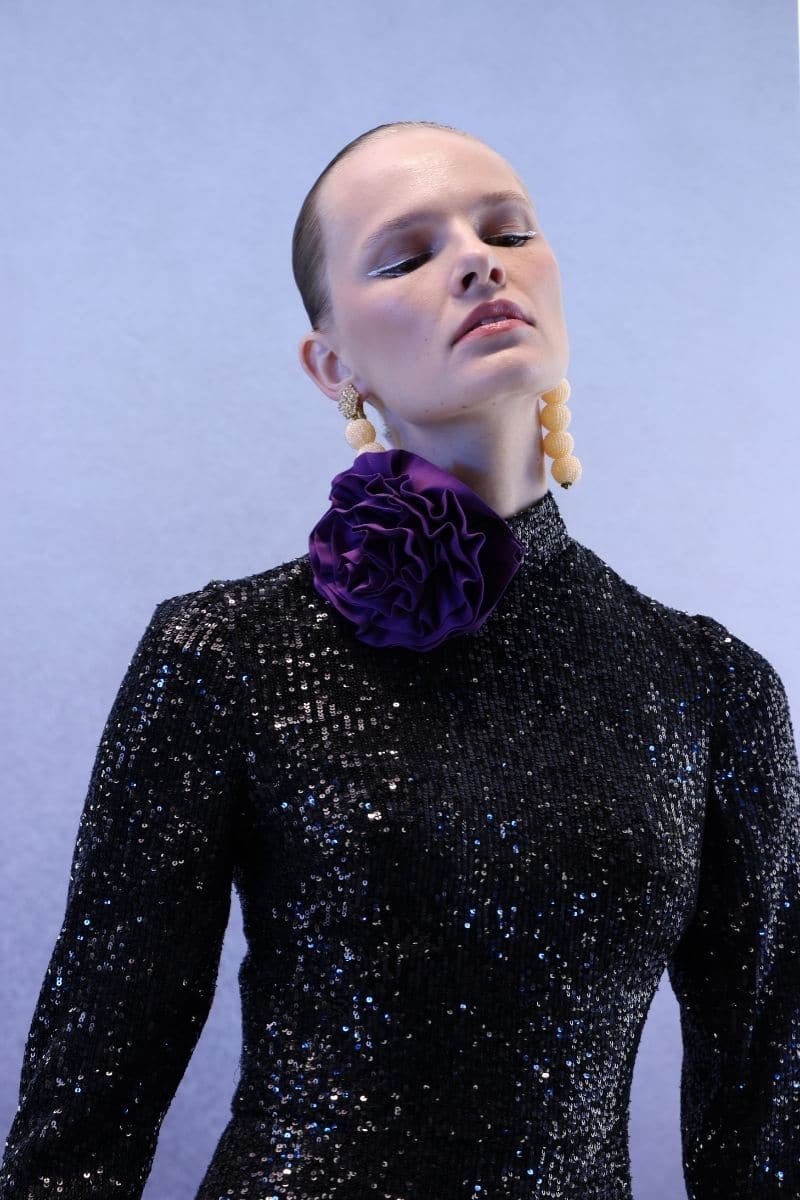 Full-length black sequins gown by Joanna Andraos, featuring a sleek, elegant design and midnight black color.