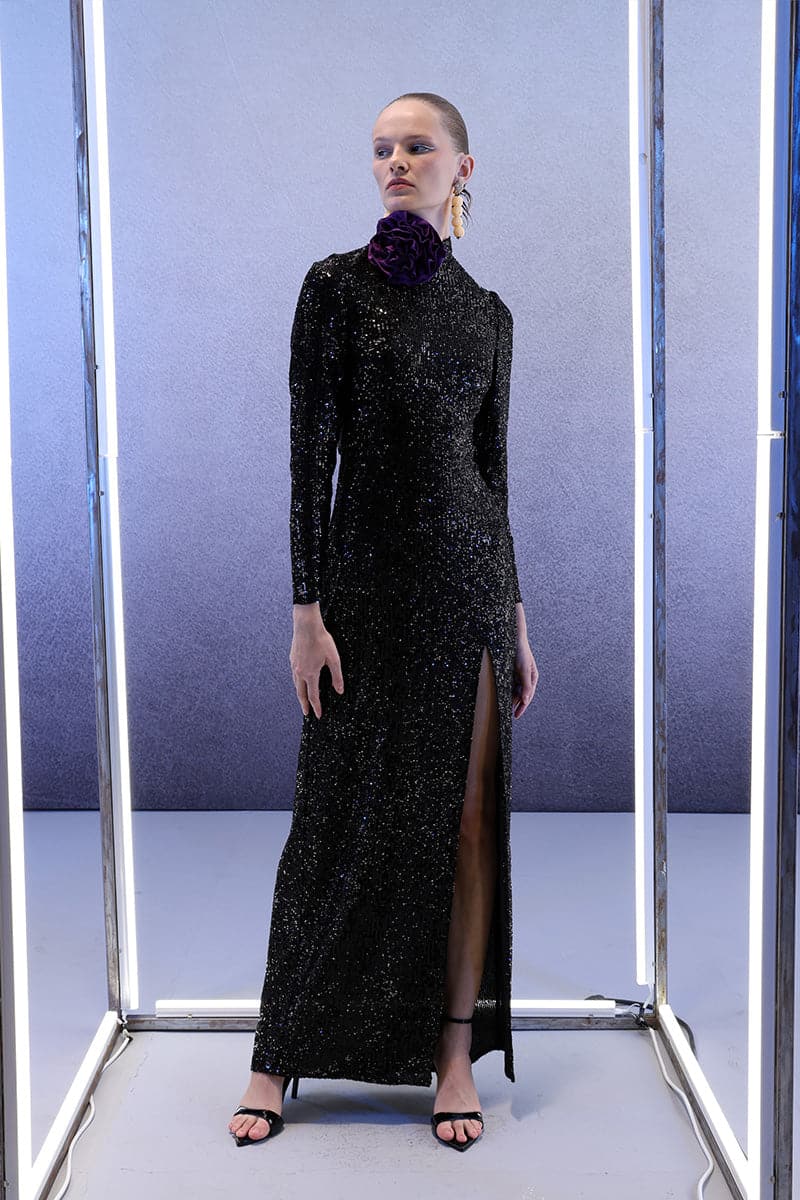 Full-length black sequins gown by Joanna Andraos, elegant midnight black maxi dress with shimmering sequins.