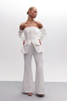 Off-white Joanna Andraos strapless bridal co-ord ensemble with top and pants, elegant and modern wedding outfit for special occasions.