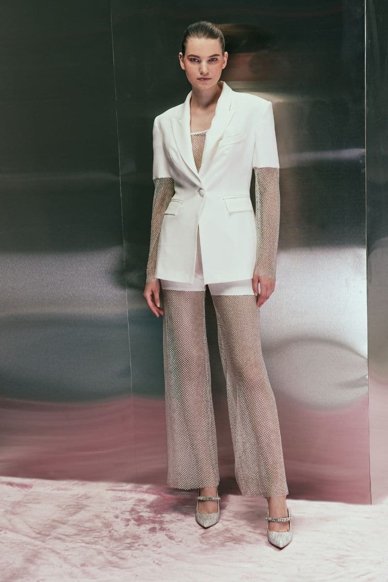 Off-white Joanna Andraos white diamond blazer displayed on a hanger, showcasing tailored fit and elegant lapel details.
