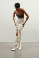 Ecru fit cut midi skirt with front slit by Kris Marán, showcasing a sleek, modern design and elegant midi length.