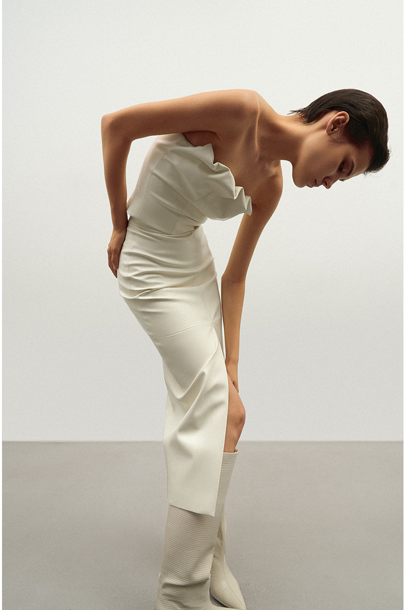 Vegan leather draped top in ecru by Kris Marán, featuring a stylish, flowing design and elegant draping detail.
