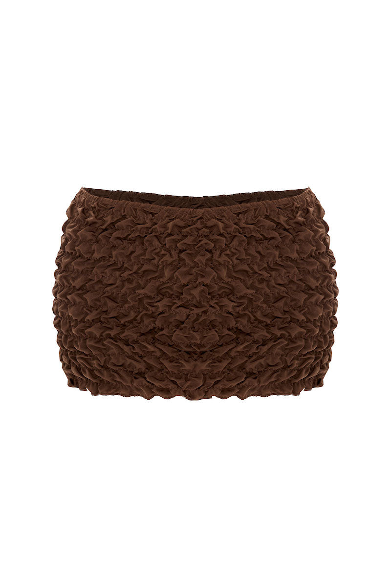 Selia Richwood LIA Brown Mini Beach Skirt cover-up with lightweight fabric, styled as a casual beachwear skirt.