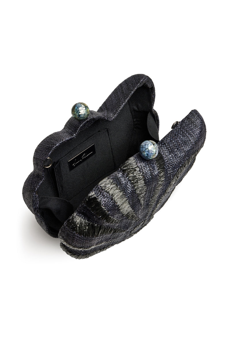 Black woven circular clutch with sea shell detail by Emm Kuo, featuring intricate craftsmanship and stylish accessory design.