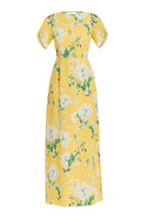 Yellow-green Katherine gown by Mestiza New York, flowing fabric and elegant design shown in the image.