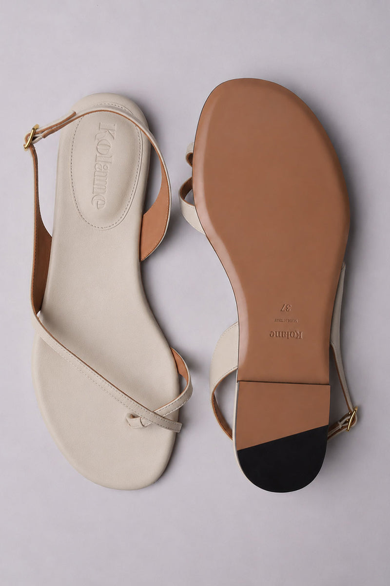 Kolane Esme ivory sandal featuring a sleek design with open toes and ankle strap for stylish summer wear.
