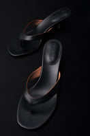 Black Annie Sandal 45 by Kolane, stylish open-toe sandals with ankle straps, featuring a sleek, modern design.