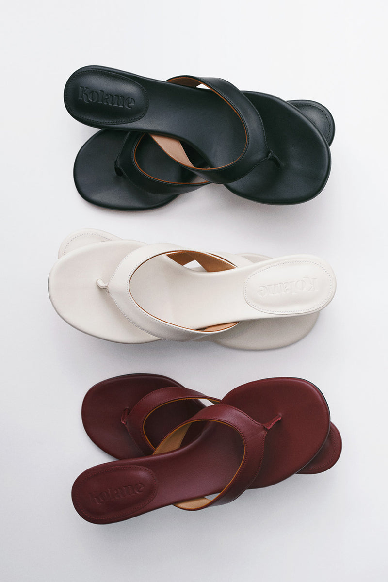 Kolane Annie Sandal 45 in ivory with strappy design and open toe, featuring a comfortable flat sole.