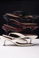 Black Kolane Annie Sandal size 45 with sleek straps and open toe design, stylish footwear for warm weather.