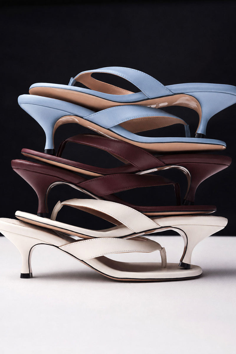 Powder blue Kolane Annie Sandal with open toe straps and ankle buckle, stylish summer footwear.