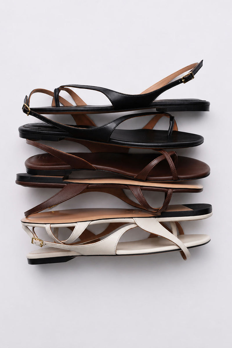 Kolane ESME ivory sandals with open toes and ankle straps, stylish footwear for casual or dressy occasions.