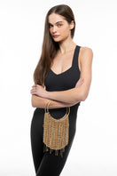 Black LE FLUFF FLUFF top handle bag by Silvia Gnecchi, featuring soft texture and elegant design, shown in a stylish outdoor setting.