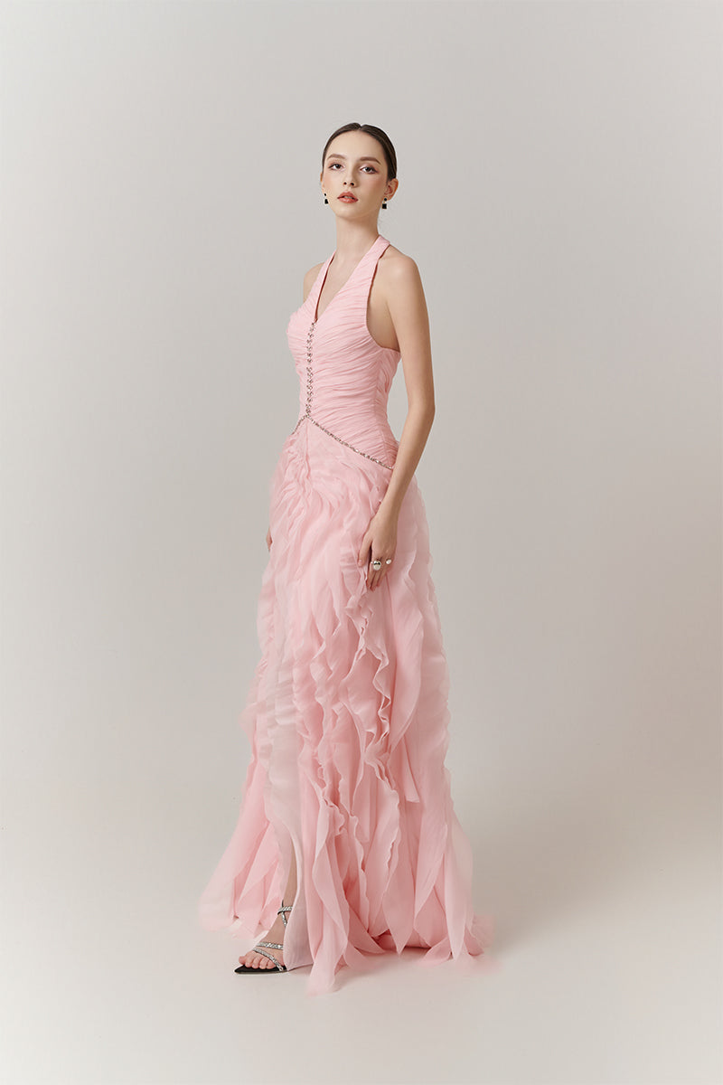 Elegant blush cascade halter gown by Happy Clothing, featuring flowing fabric and a stylish halter neckline.